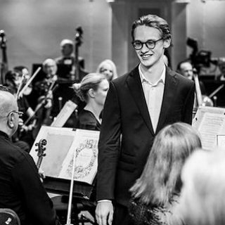 A black and white image of the orchestra