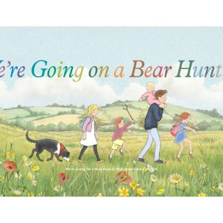 An image of five children and a dog walking through a field, with the title "We're Going on a Bear Hunt" above them.
